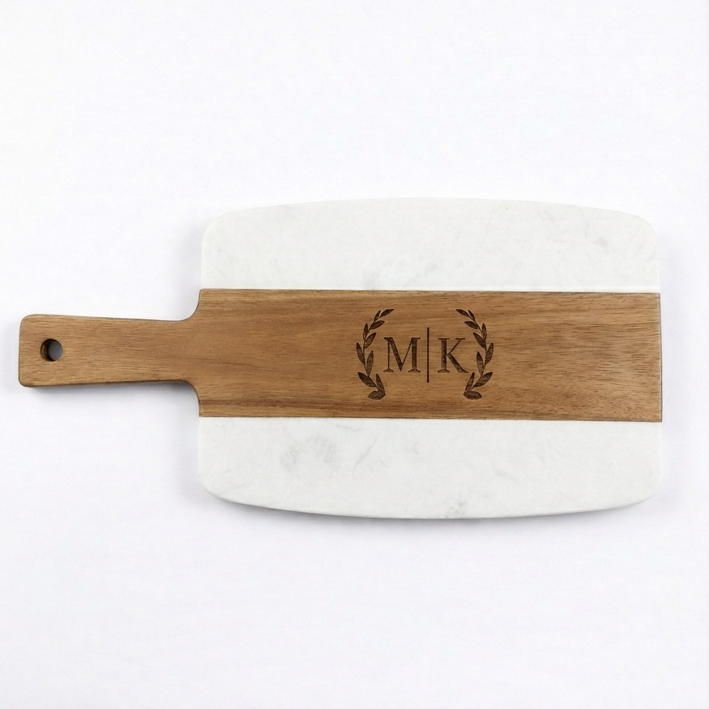 Medium marble and wood cutting board with handle, featuring a couple’s two-initial monogram